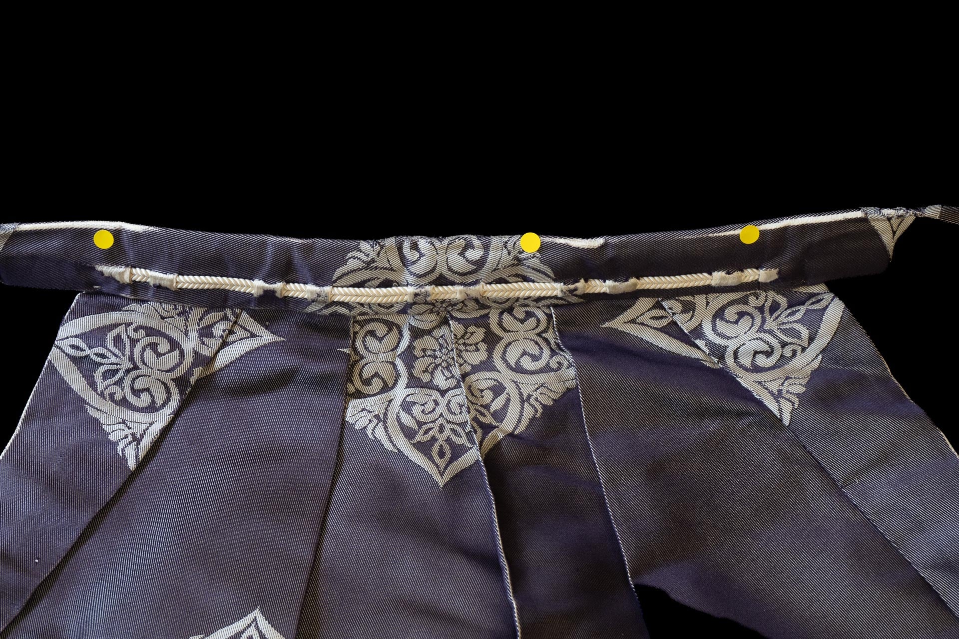The waist and cords of a hakama